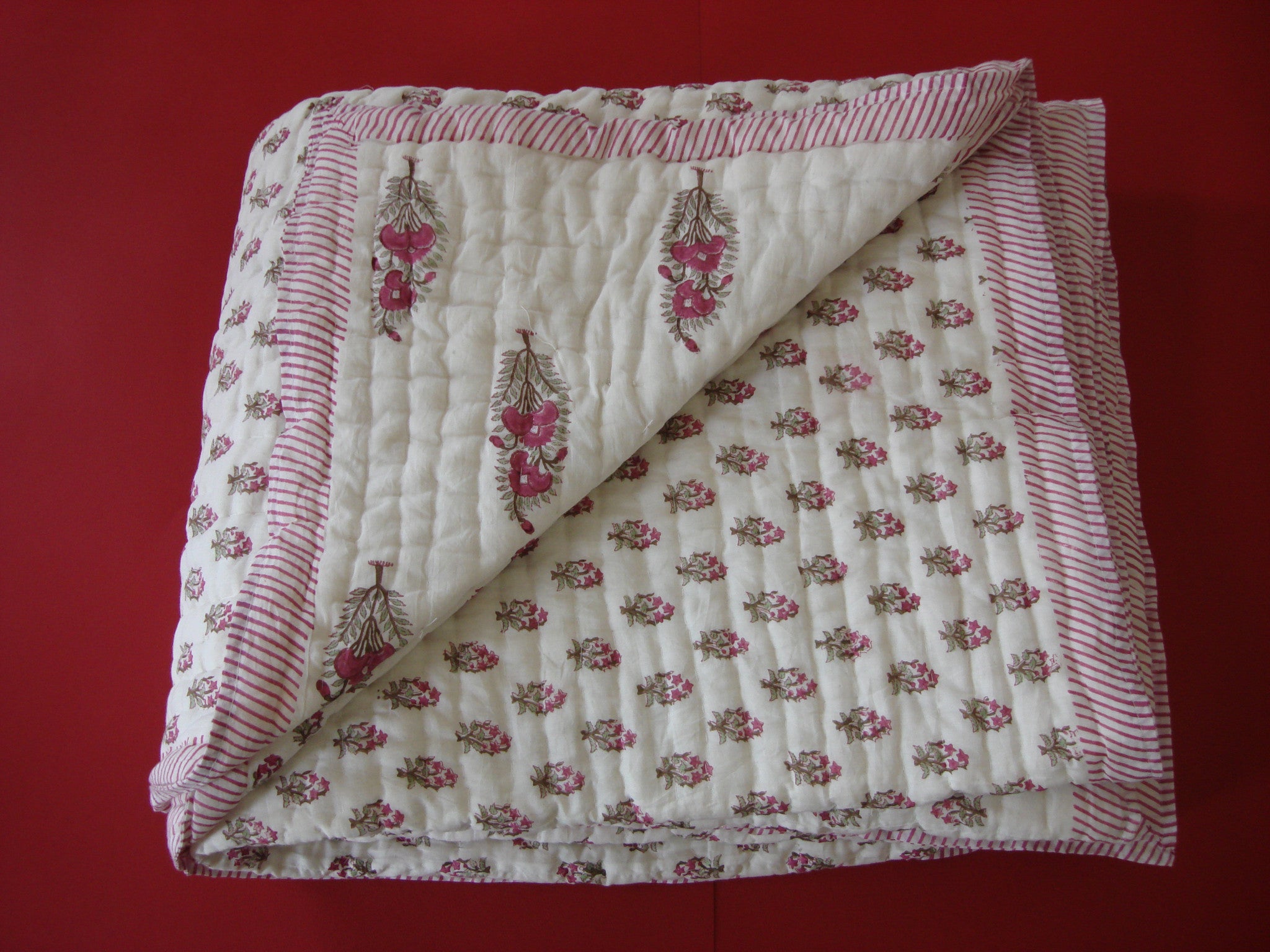 QBP 107 - Handmade, reversible, cotton, block printed quilt in bright pink floral design. - Pentagon Crafts