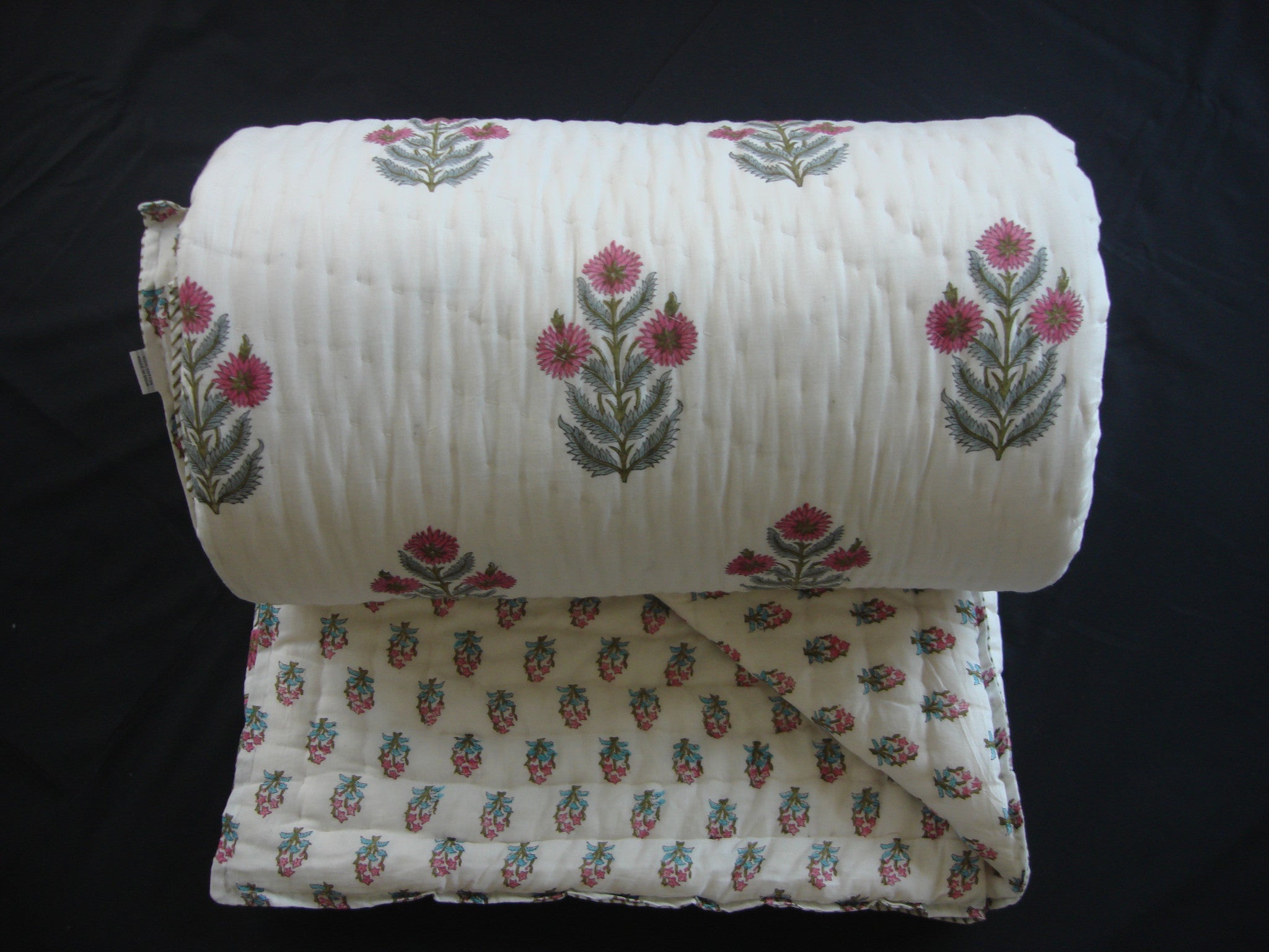 QBP 117 - Handmade, reversible, cotton, block printed quilt in bright pink floral design - Pentagon Crafts